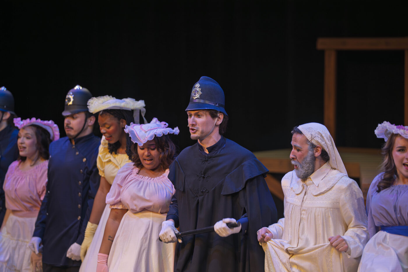 Sergeant amid the ensemble in white